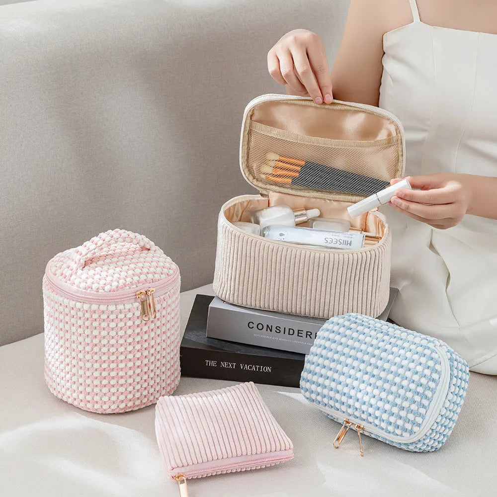 Set of four cube-shaped flannelette makeup bags in a choice of colours including pink dots and blue with dots.