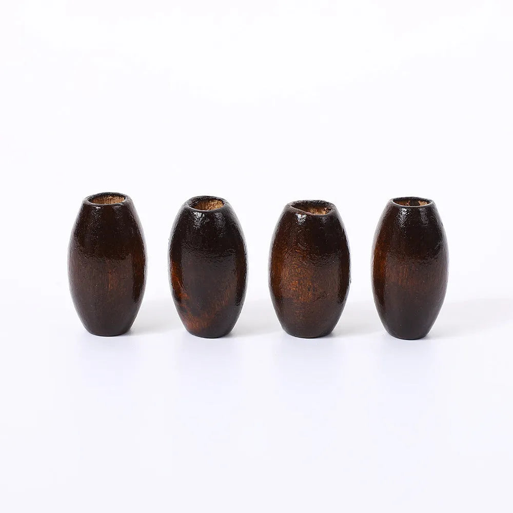 Oval M-shaped wooden bead in dark coffee colour with raised design, 25mm diameter