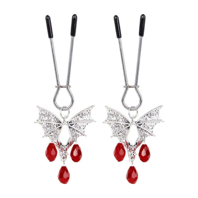 Silver bat nipple clamp with ruby detail and adjustable mechanism