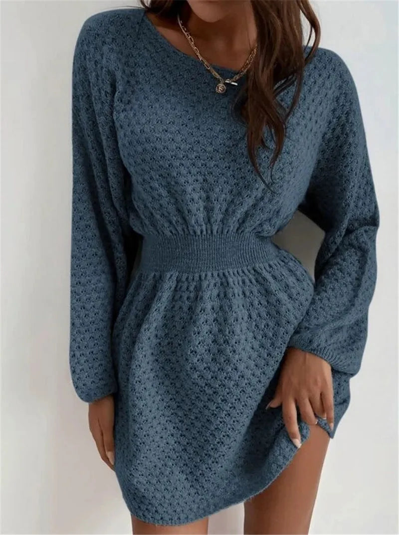 Blue women's knitted dress with crocheted flowers, round neck, and fitted waist.