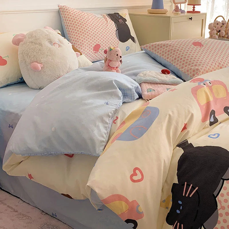 Cartoon dog pattern four-piece cotton quilt cover set laid on a bed.
