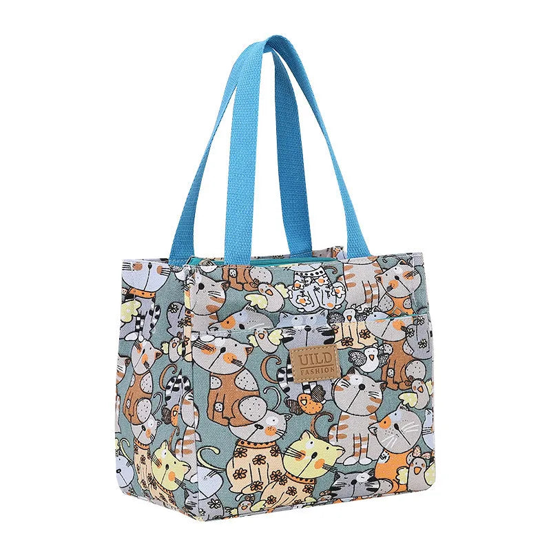 Women's printed canvas handbag with aluminium frame in a horizontal square shape, shown in a floral design.
