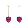 A pair of geometric strawberry-shaped stud earrings with spot drill texture, shown in red zinc alloy.
