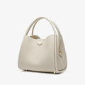 Genuine leather vegetable basket handbag in cylindrical shape with open pocket outer and sandwich zipper bag interior