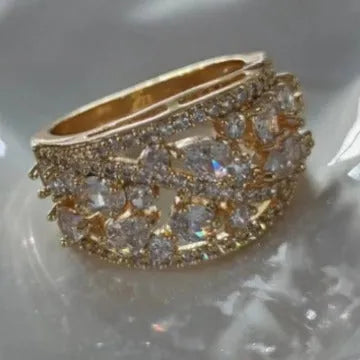 Women's round copper ring with hollow openwork centre in gold sapphire blue colour.