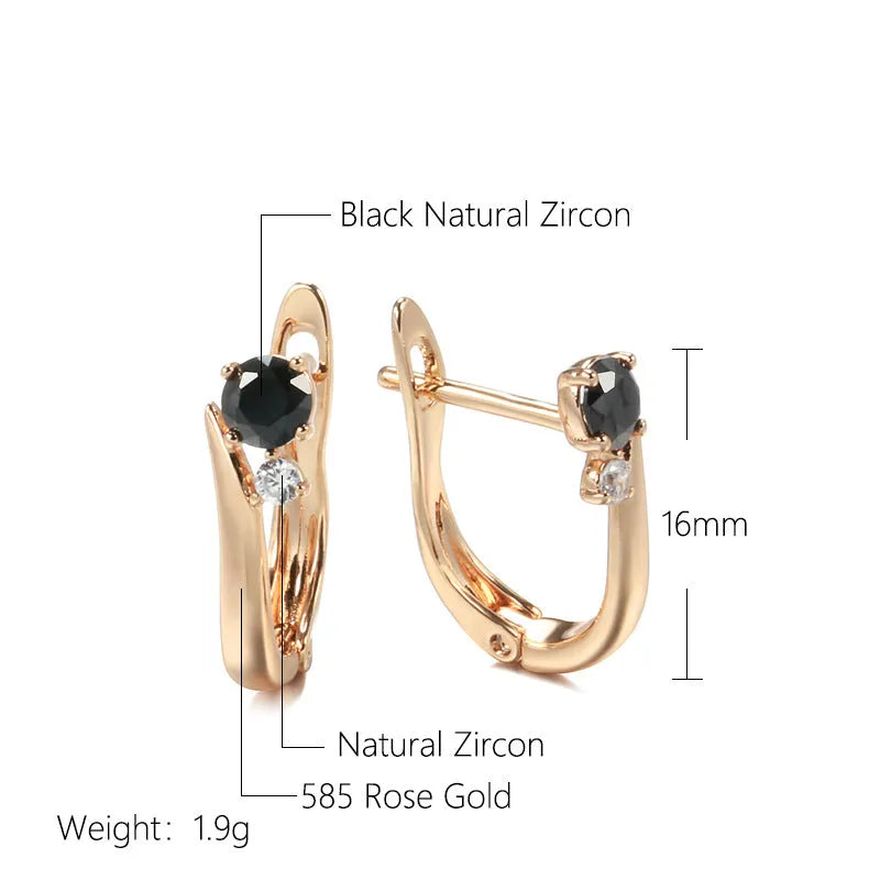 Gold drop-shaped earrings with geometric patterns and artificial gemstone inlay