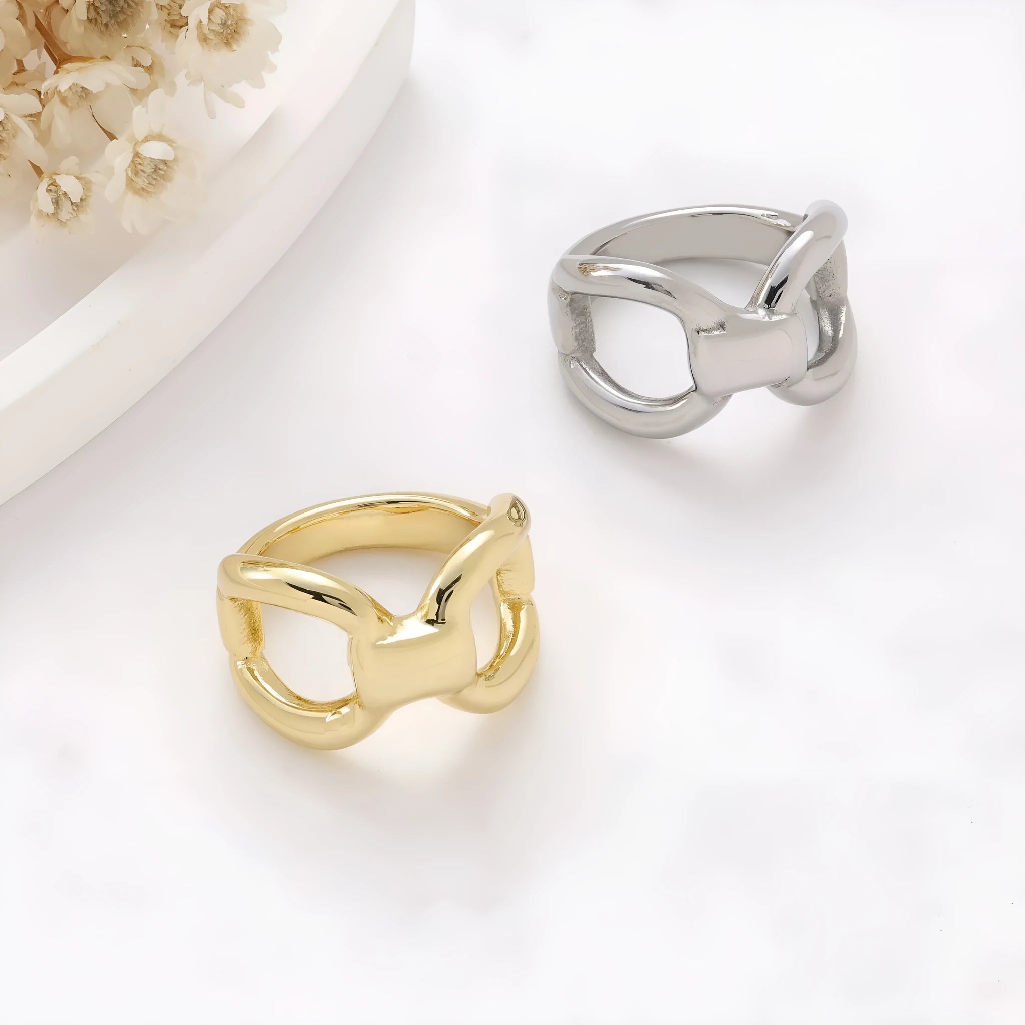 Gold or steel colour titanium steel women's ring with hollow bow shape and butterfly geometric design.
