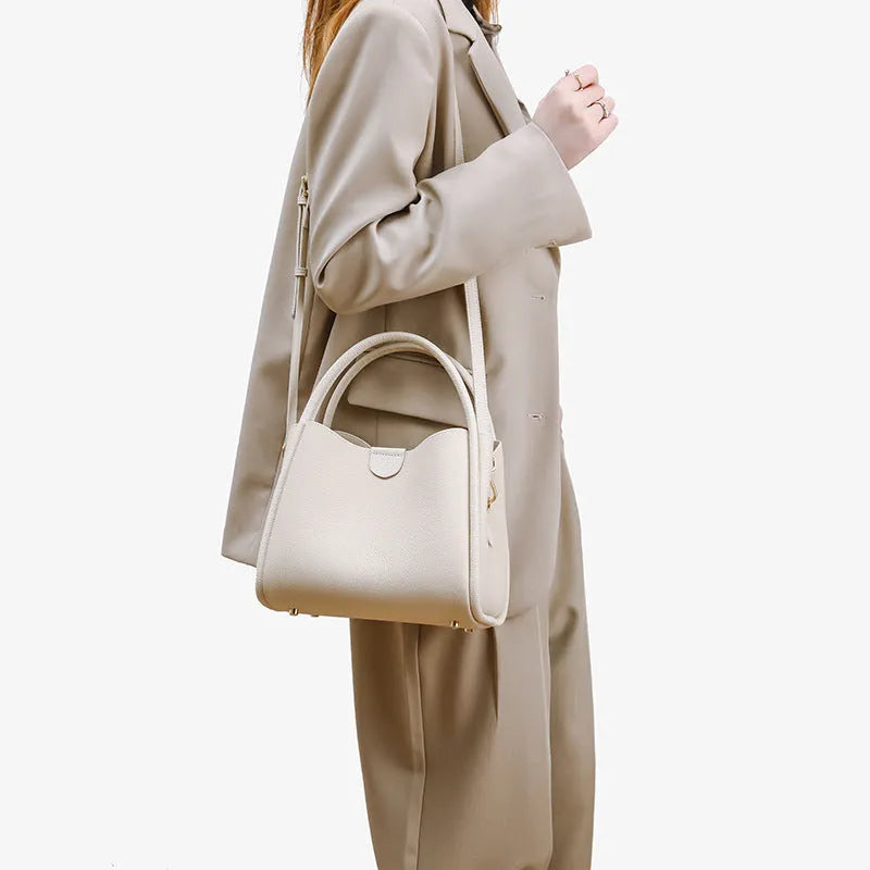Genuine leather vegetable basket handbag in cylindrical shape with open pocket outer and sandwich zipper bag interior
