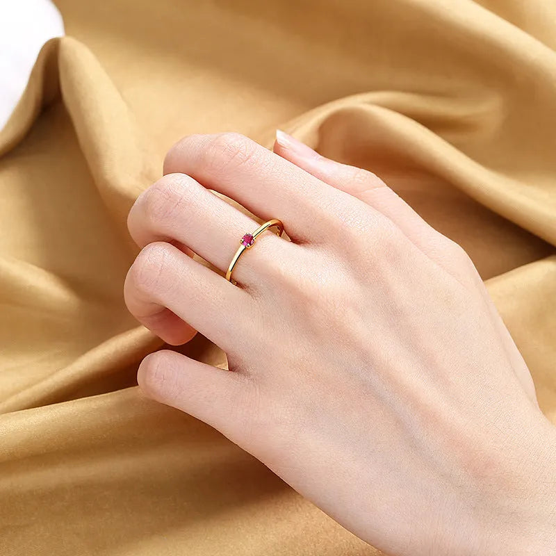 Geometric copper fine circle ring with single diamond detail showing white colour option