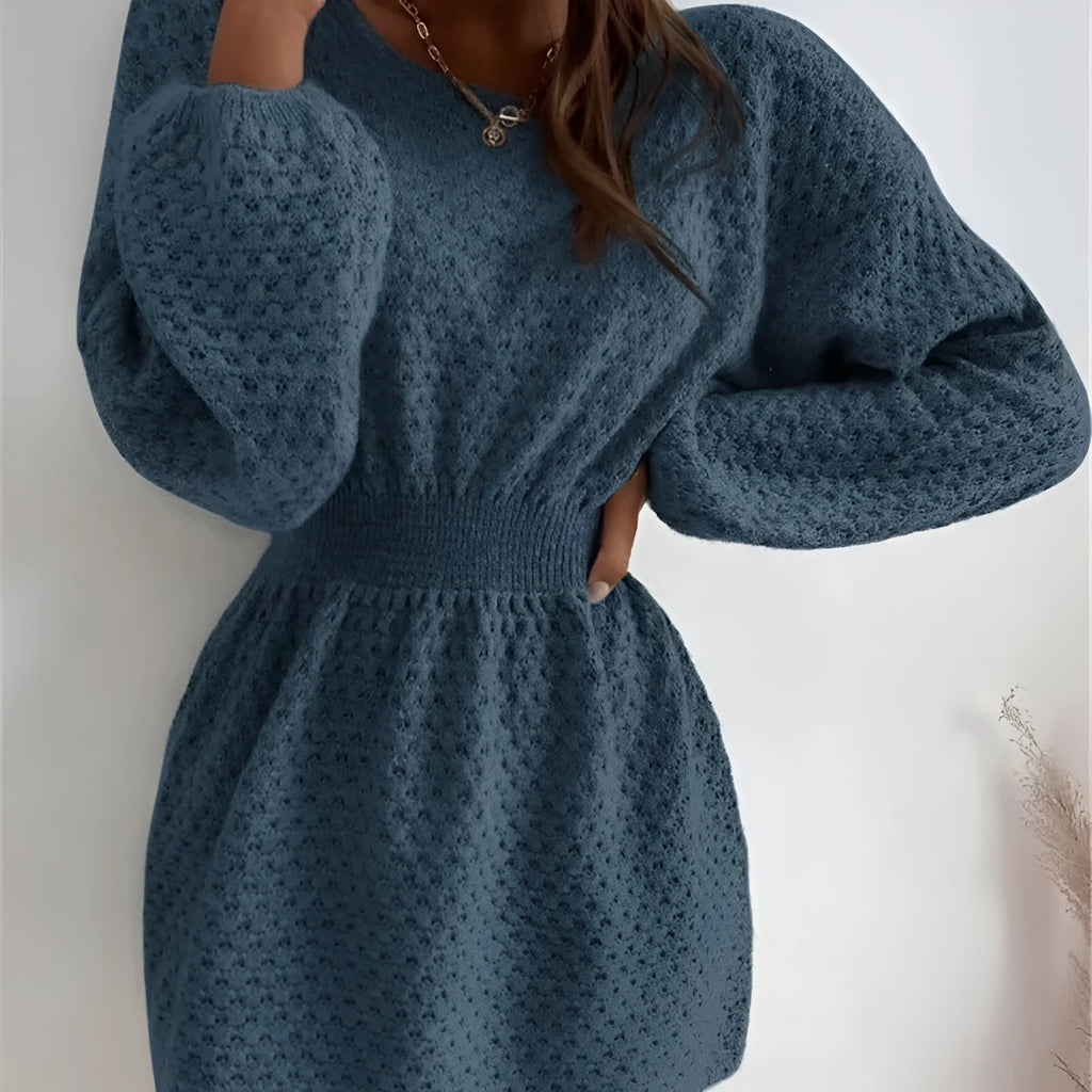 Blue women's knitted dress with crocheted flowers, round neck, and fitted waist.