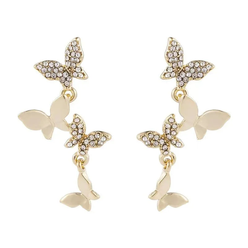 Women's copper earrings with four butterfly designs and gold butterfly-shaped pendant drops