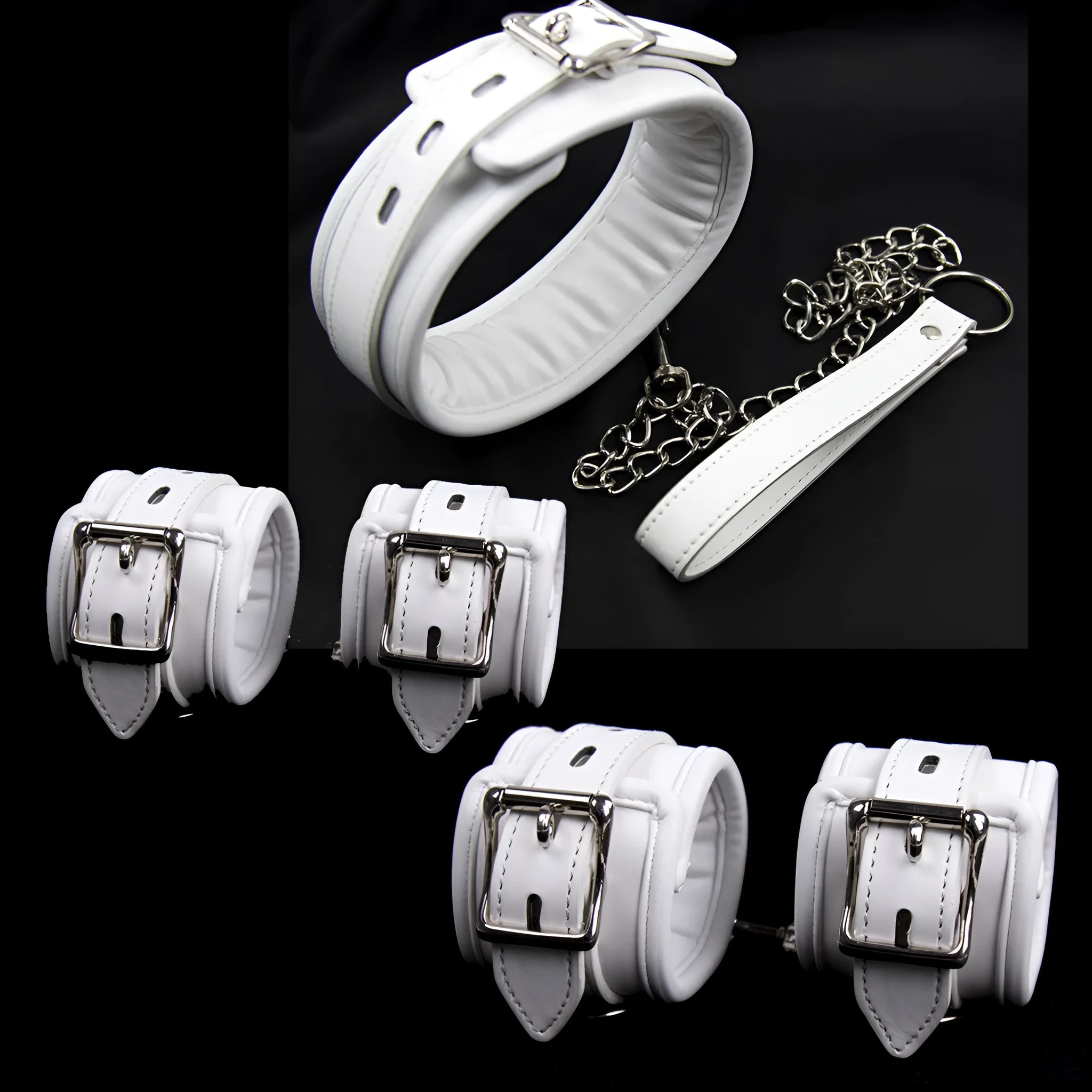 White PU sponge bondage set showing handcuffs, foot cuffs, and a neck scarf arranged together.