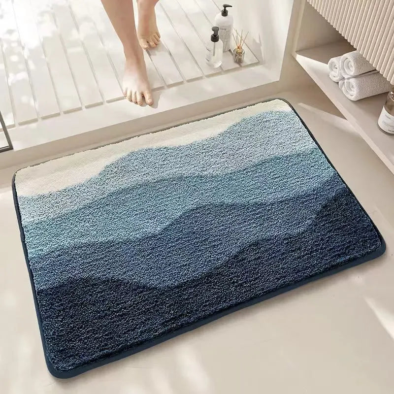 Square cashmere carpet floor mat with rainbow pattern in Sky Sea colour and plastic bottom.