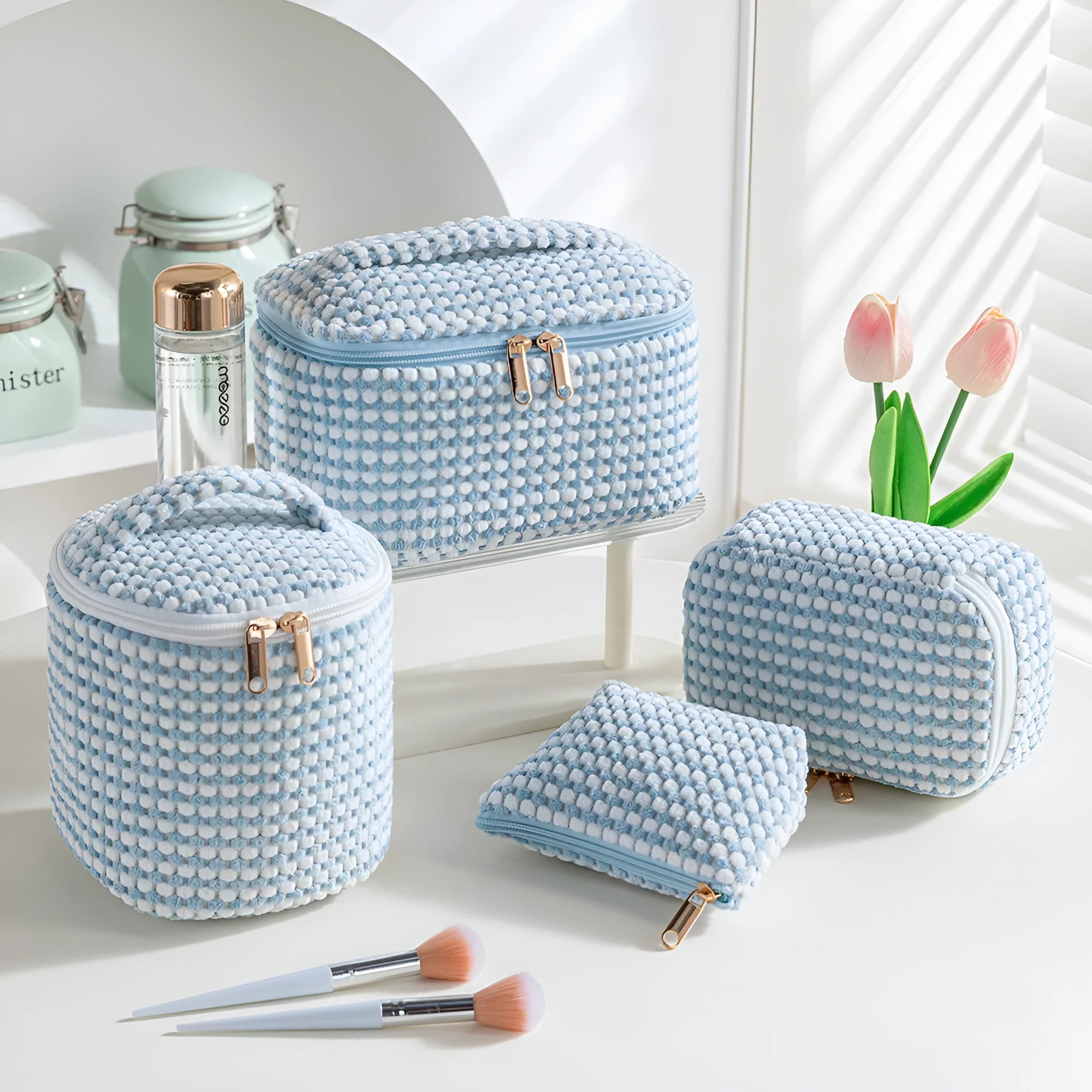 Set of four cube-shaped flannelette makeup bags in a choice of colours including pink dots and blue with dots.