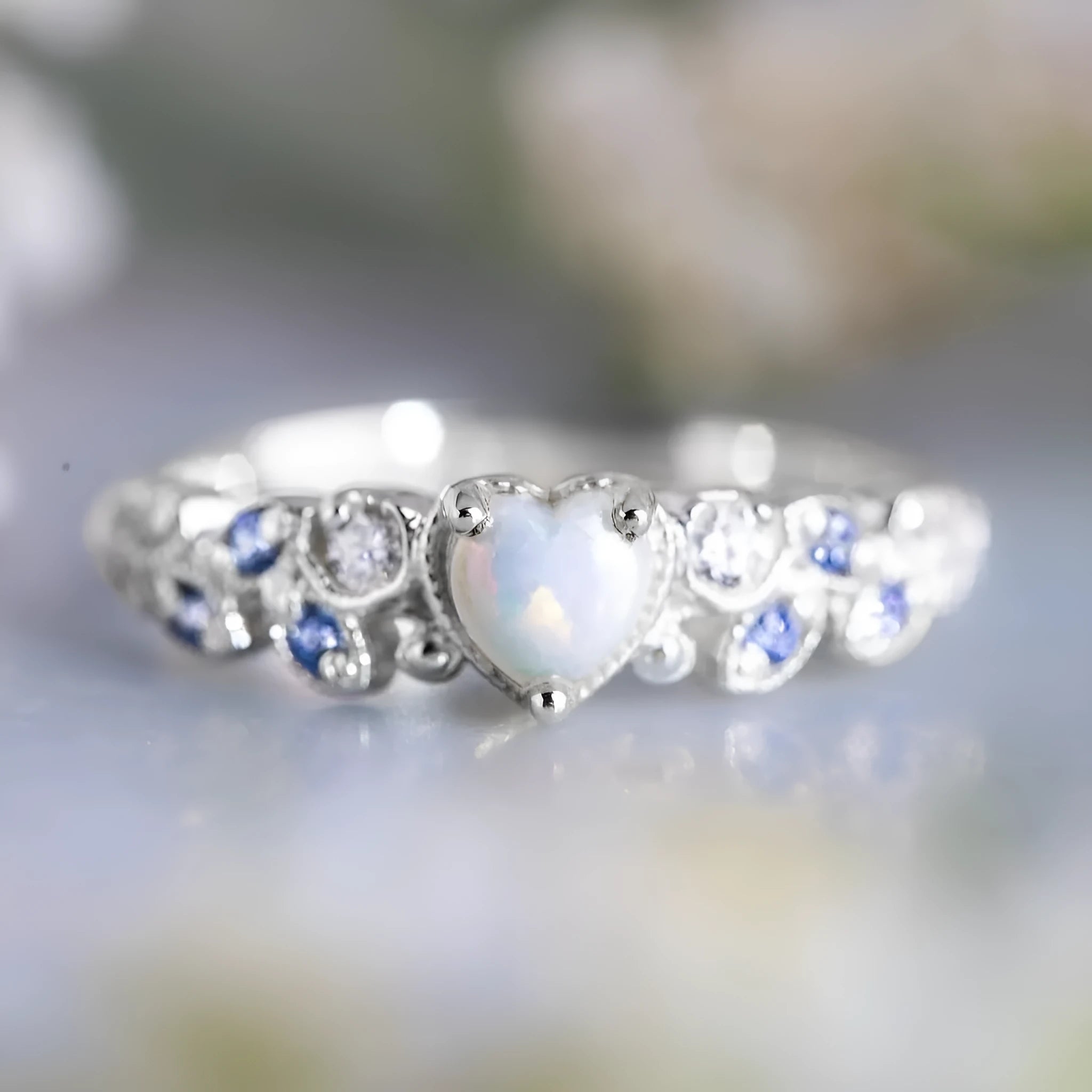 White alloy women's ring with a heart shape and floral opal ocean design.