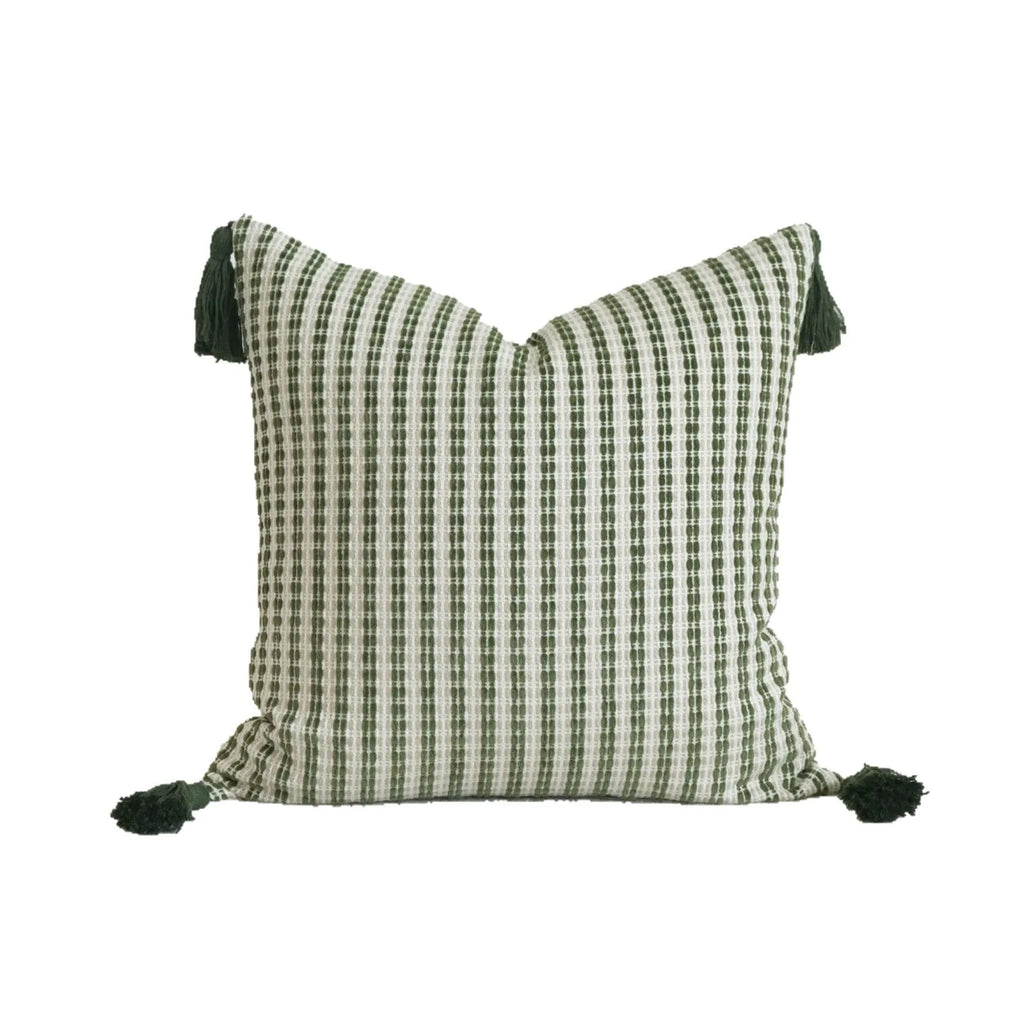Green decorative pillow with tassel or beaded design on a cotton linen blend cover.