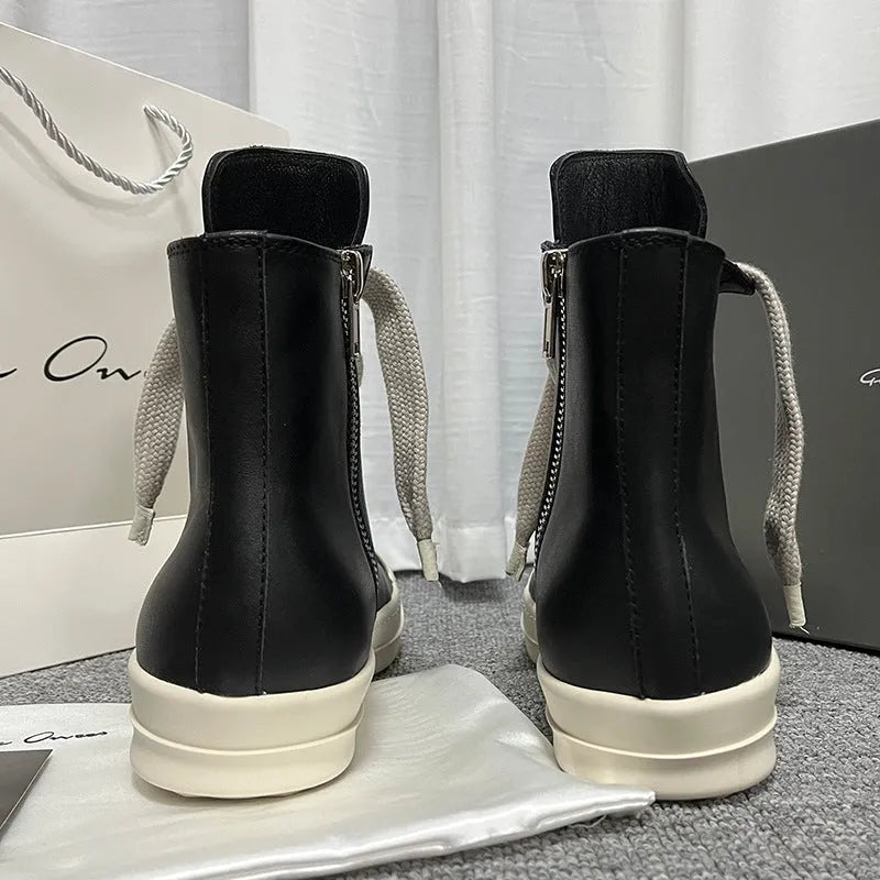 Men's and women's high-top leather sneakers in black with a side zipper and round toe on a rubber sole.