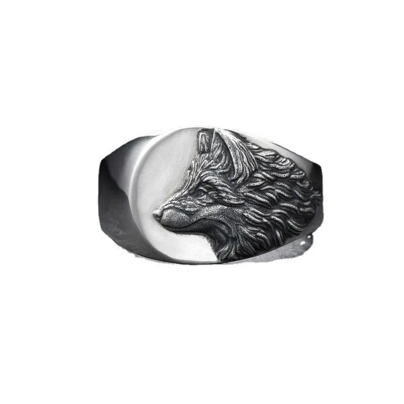 Men's silver geometric wolf-shaped alloy ring on a grey background.