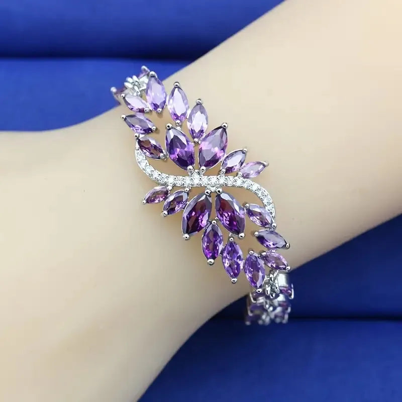 Gold electroplated copper fashion bracelet with zircon stones and ice flower design in multiple colours.