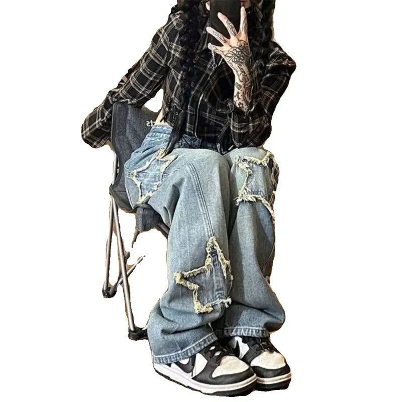 Blue high-waisted straight-leg women's jeans on a hanger.