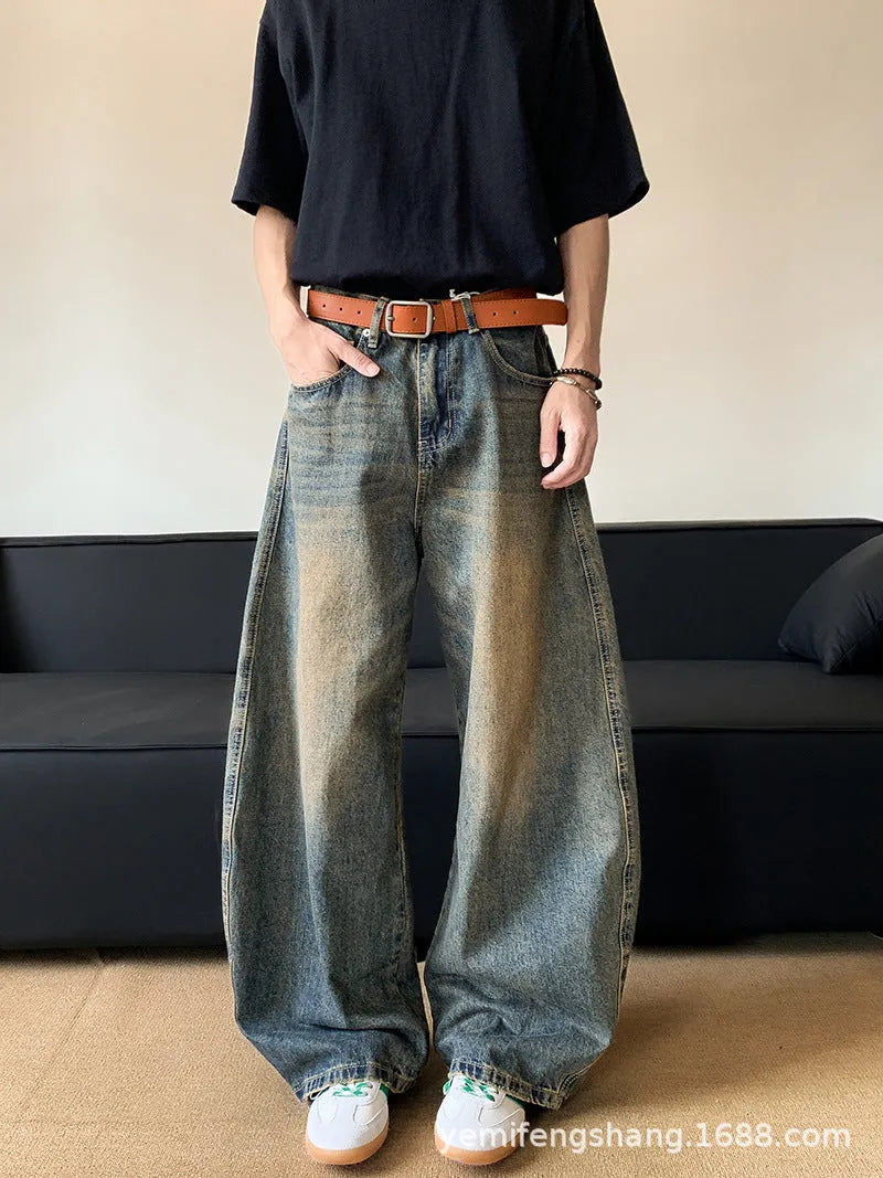 Retro blue distressed men's jeans with wide leg fit and micro elastic cotton blend fabric