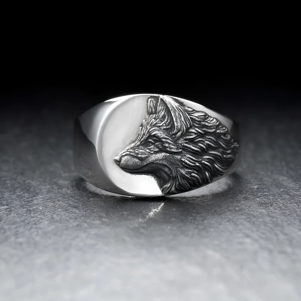 Men's silver geometric wolf-shaped alloy ring on a grey background.