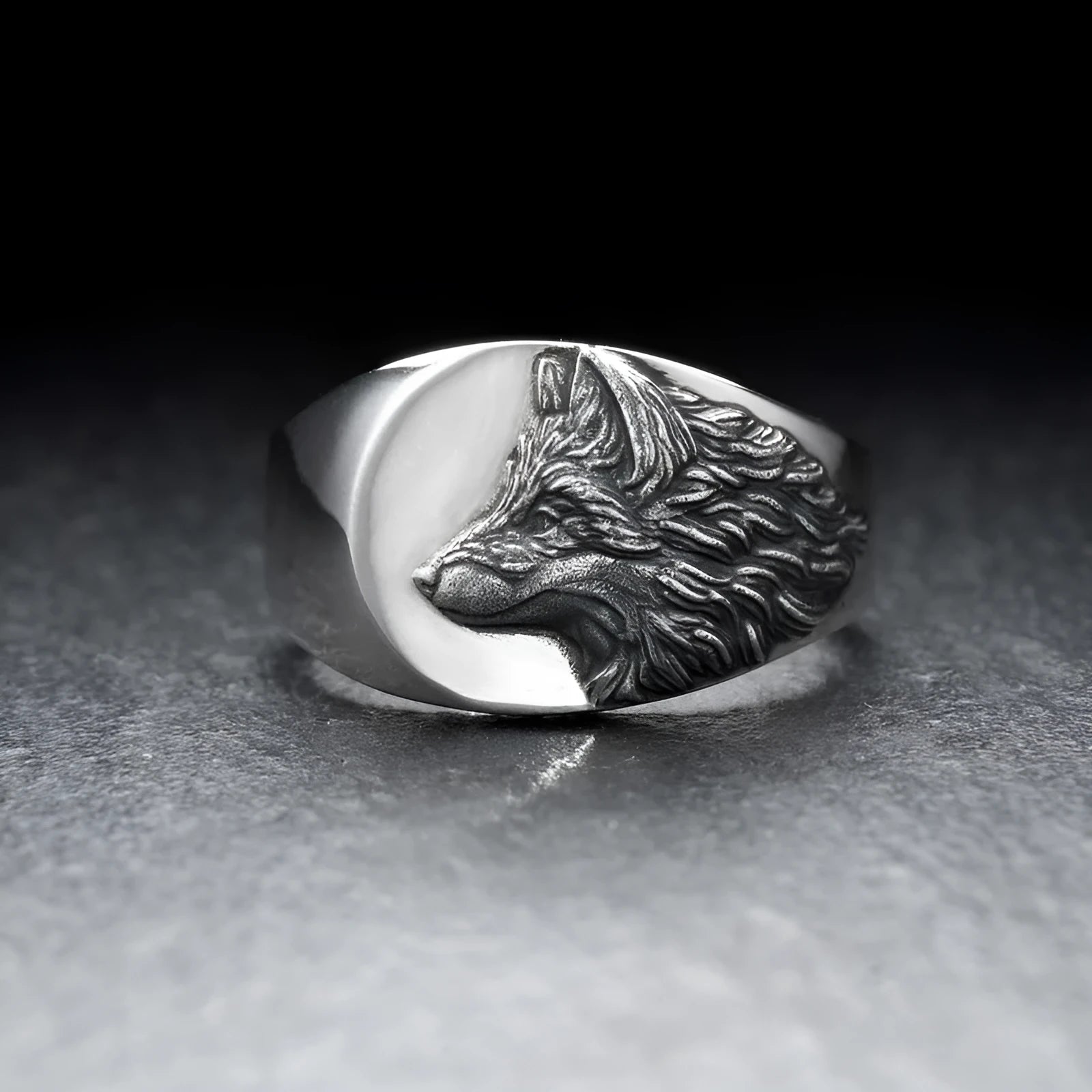 Men's silver geometric wolf-shaped alloy ring on a grey background.