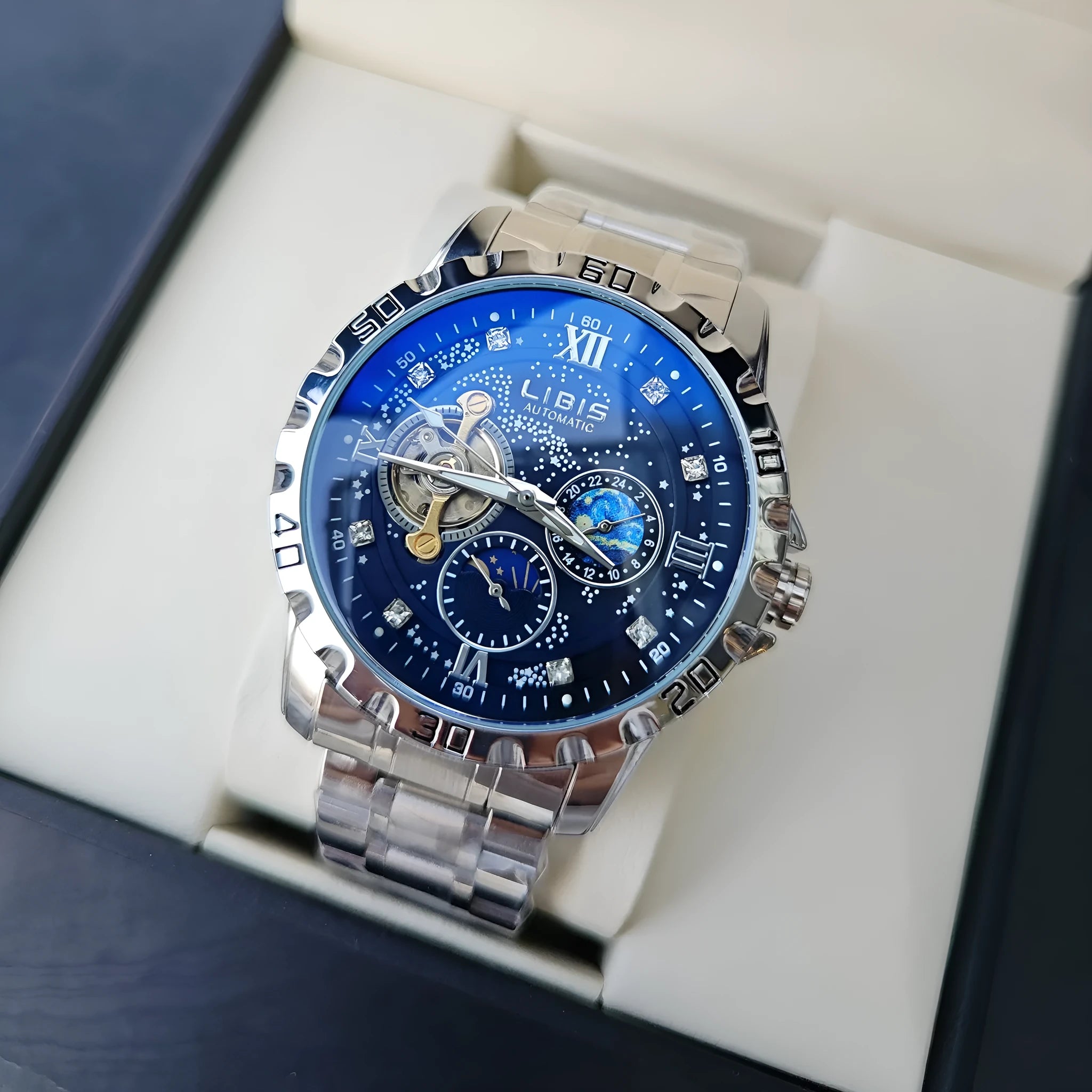 Men's silver automatic watch with black leather strap and transparent case back.