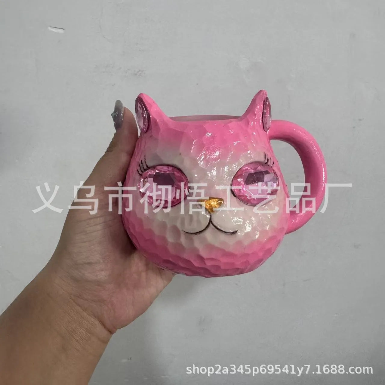 Crystal Earth globe decorative ornament on top of a colourful cat-shaped resin cup.