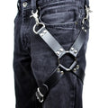 Black PU leather leggings with an elasticated waistband laid flat.