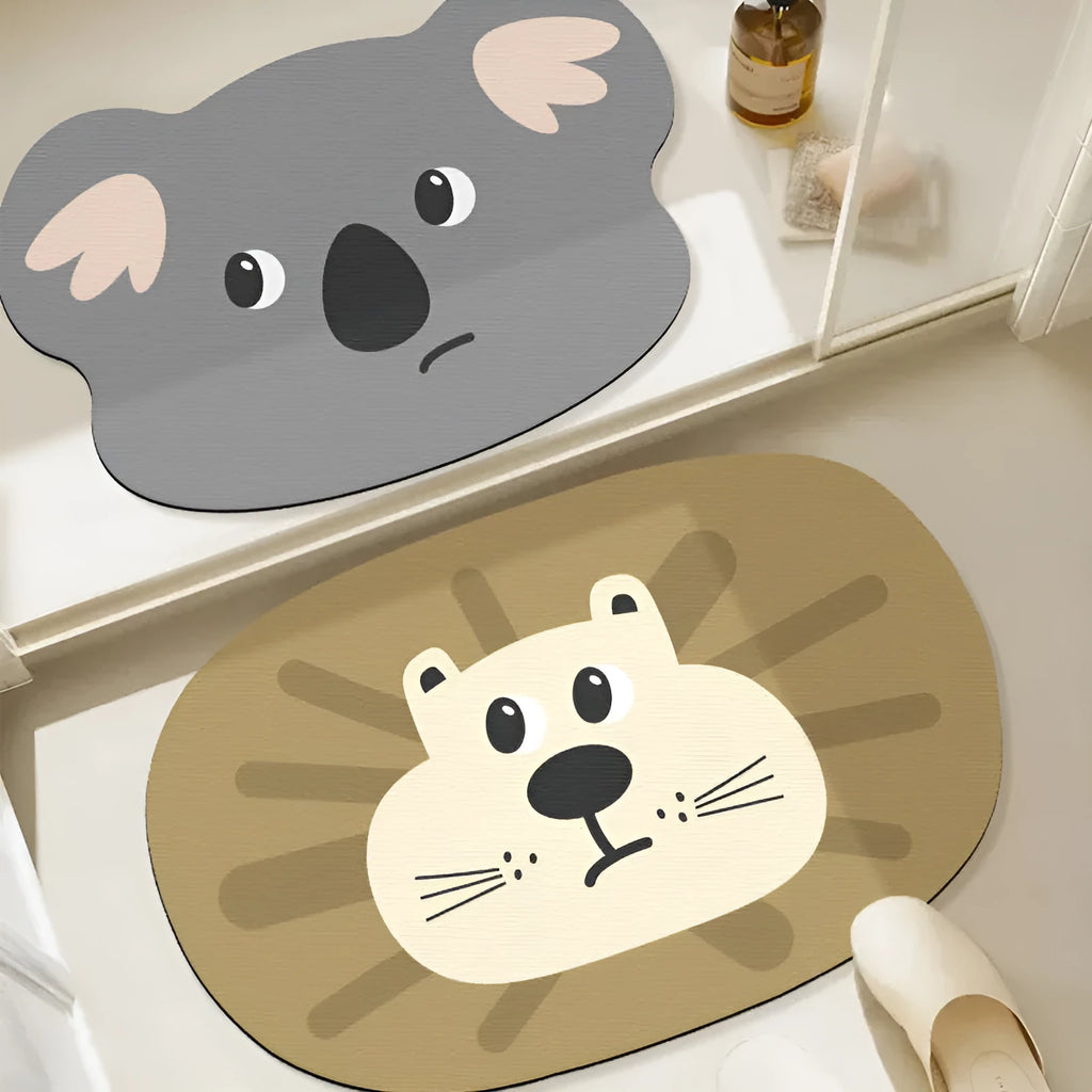 Cartoon animal diatom oil absorbent non-slip bathroom mat in alien shape on a bathroom floor.