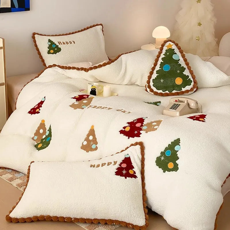 Bright yellow four-piece bedding set with a cartoon Christmas tree pattern, shown on a bed.
