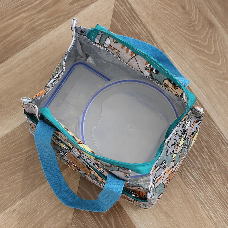 Women's printed canvas handbag with aluminium frame in a horizontal square shape, shown in a floral design.