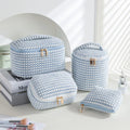 Set of four cube-shaped flannelette makeup bags in a choice of colours including pink dots and blue with dots.