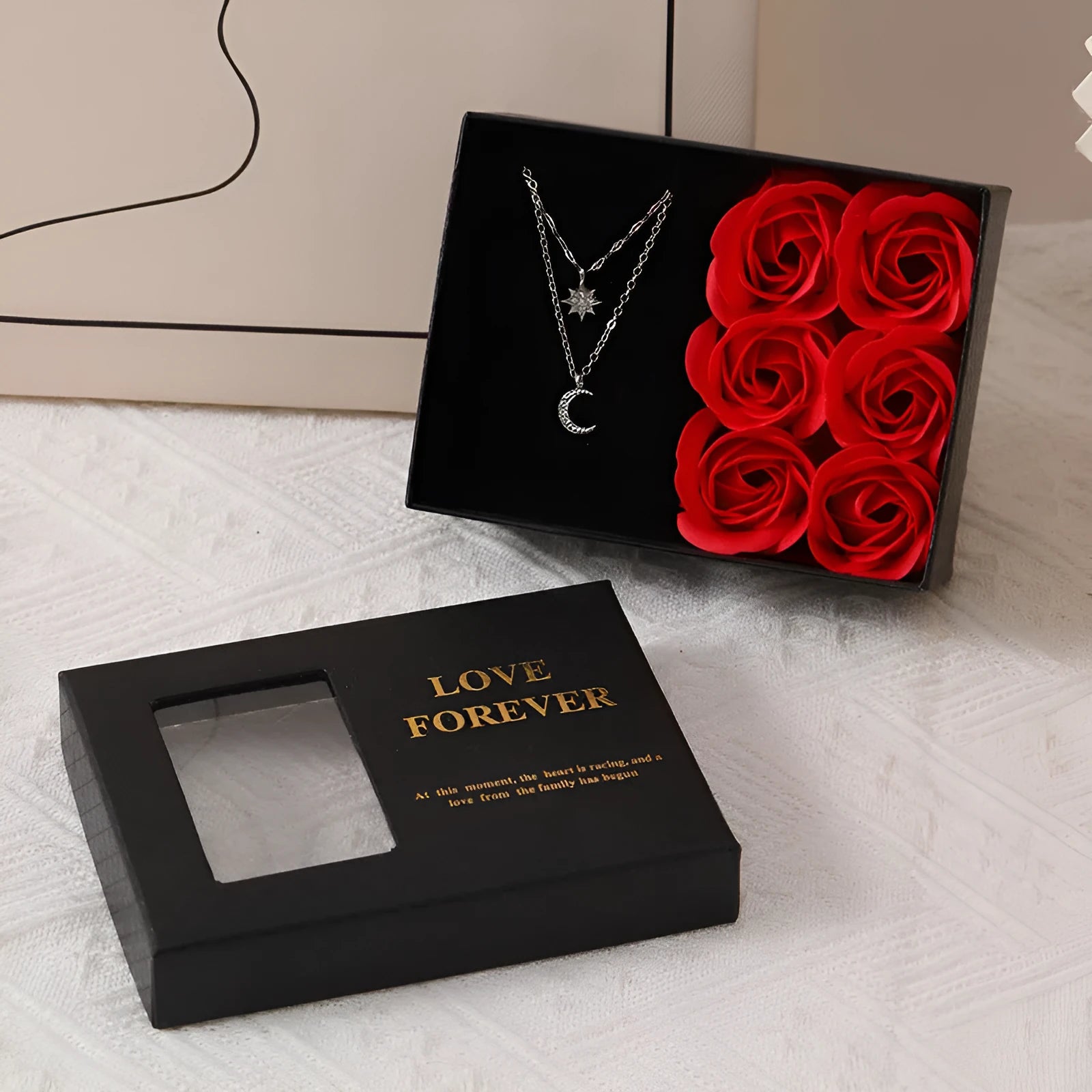 Six red soap flowers arranged in a black gift box with a matching handbag, a Valentine's Day gift set.