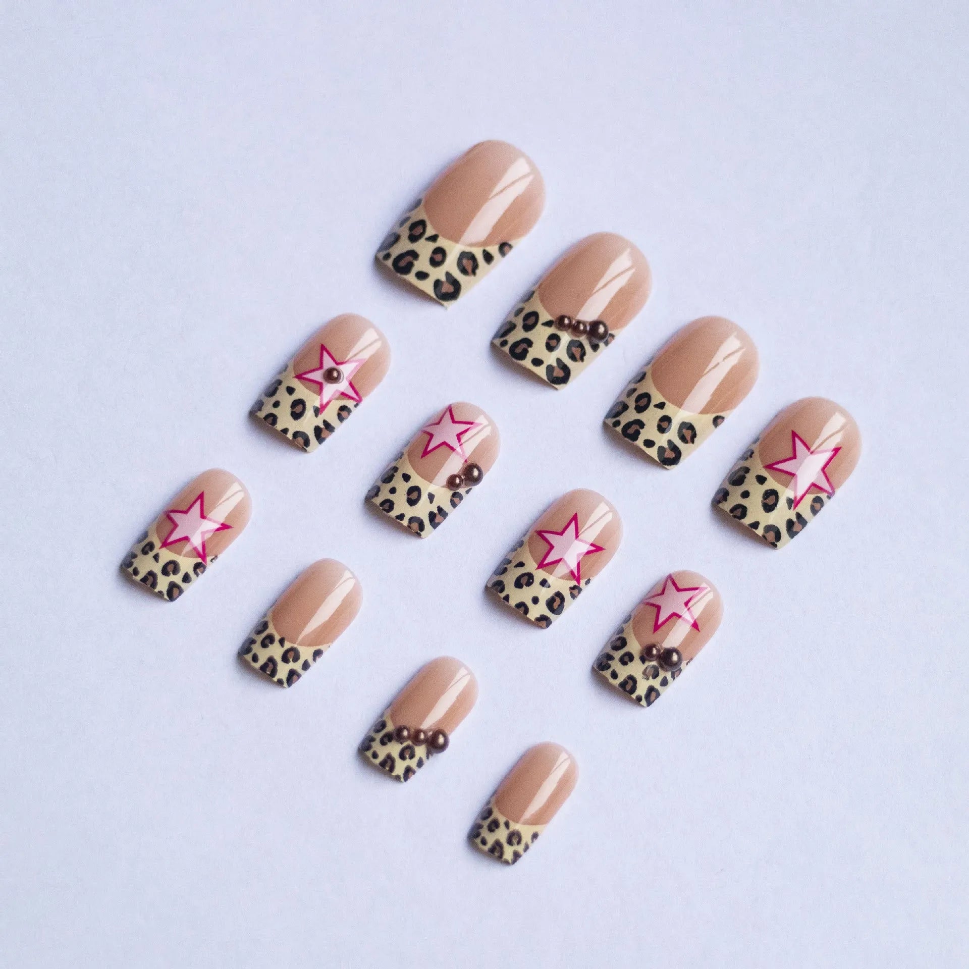 French manicure nail art set with leopard print patterns, five-pointed stars, pearls and diamond decorations