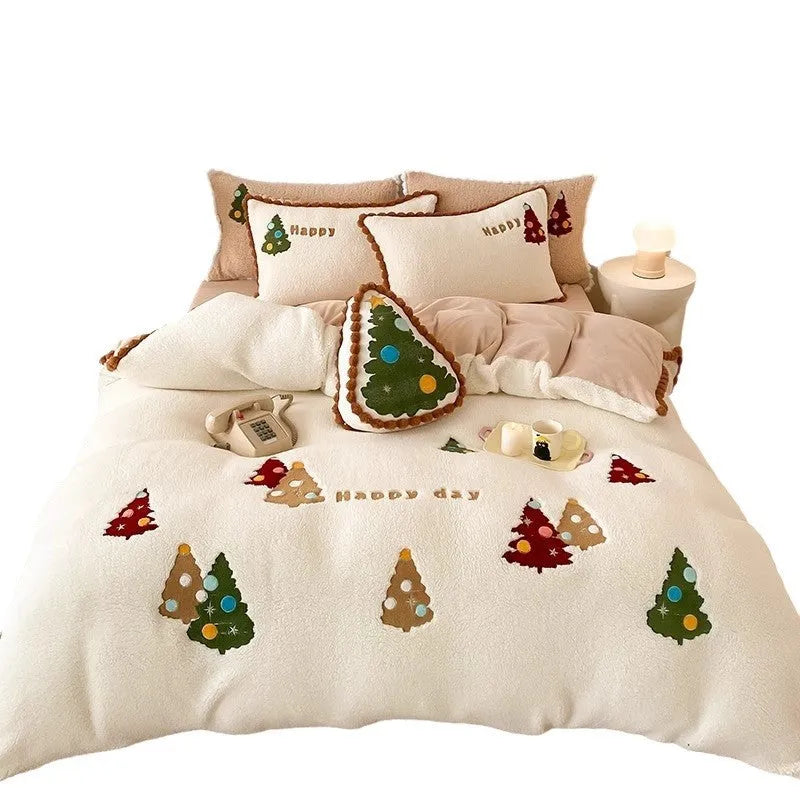 Bright yellow four-piece bedding set with a cartoon Christmas tree pattern, shown on a bed.