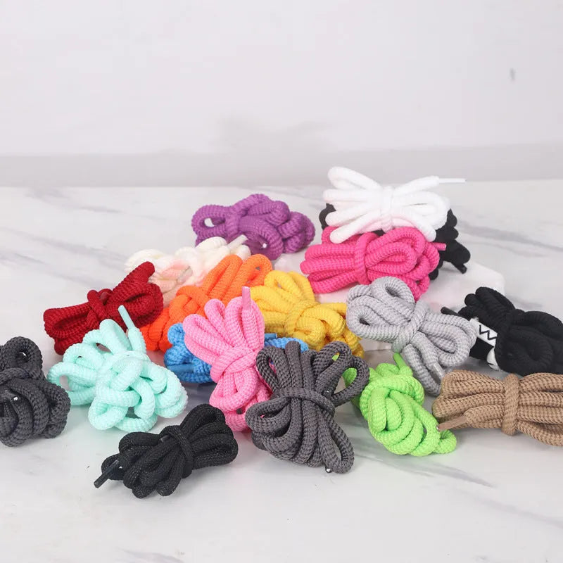 Black oval shoelace adapter rope showing round 1.0cm width, coiled to display length