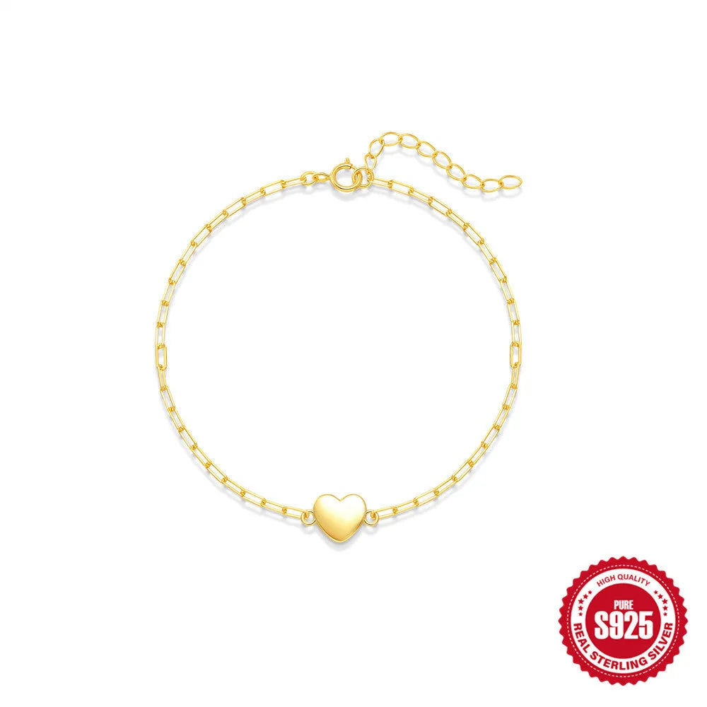 S925 sterling silver bracelet with geometric heart charm and clip chain fastening in gold plating