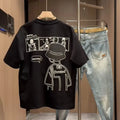Men's black and white cotton short sleeve crew neck t-shirt on a hanger