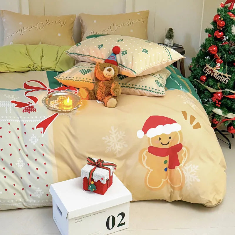 Christmas cartoon pattern four-piece bedding set with sheet, quilt cover, and two pillowcases on a bed.