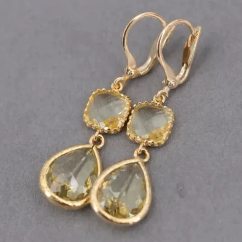 Gold geometric earrings with long crystal fringe and water droplet design