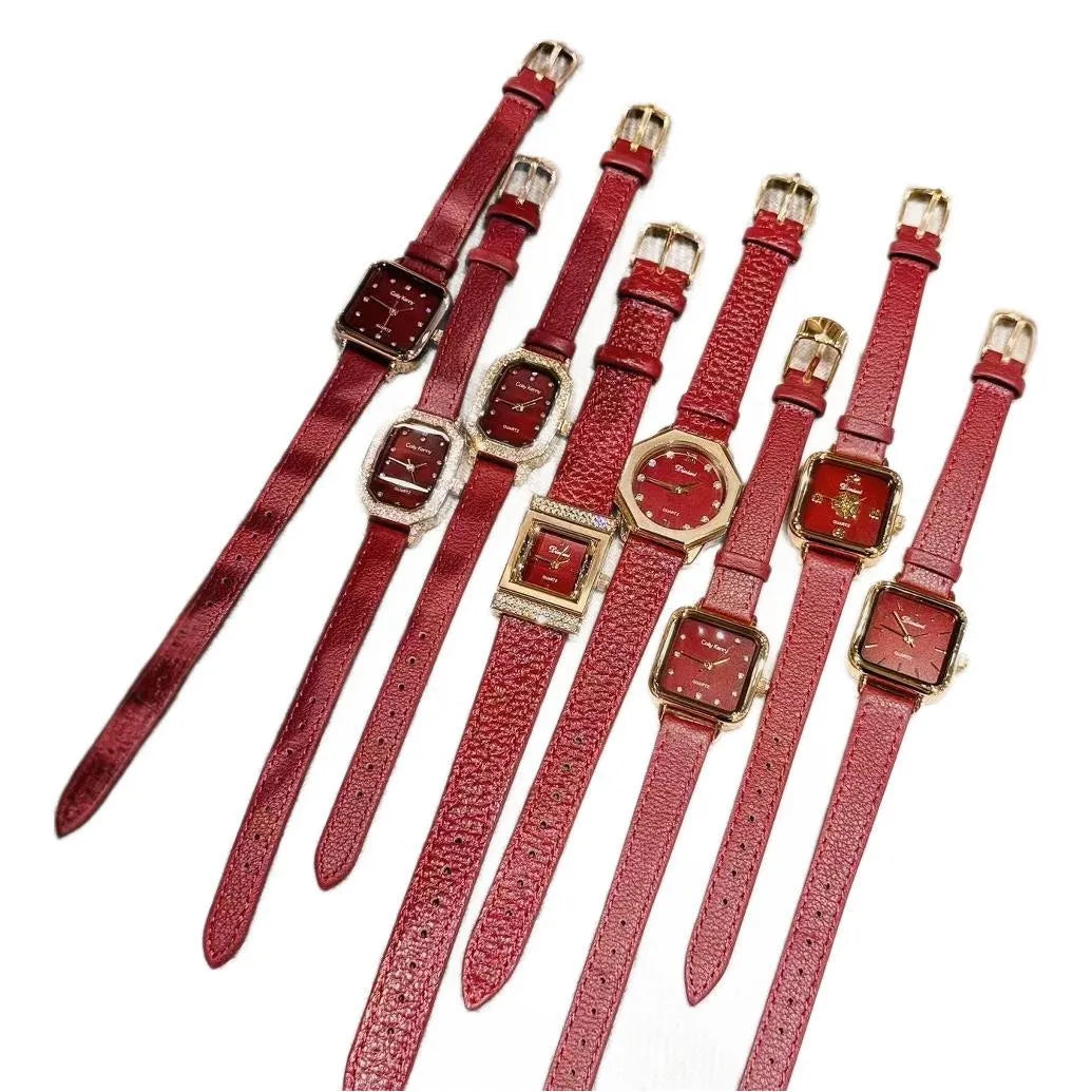 Red dial women's alloy watch with Chinese style decorative design on wrist.