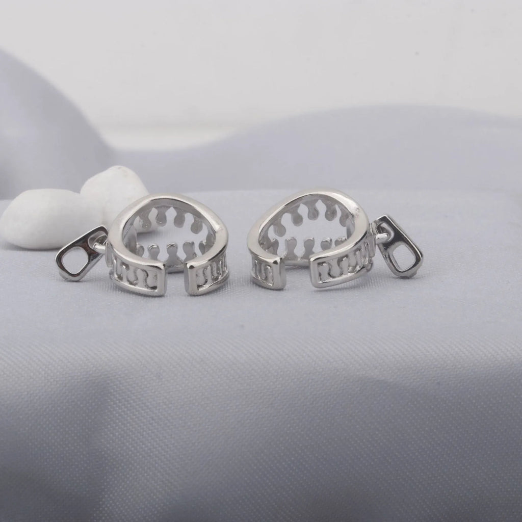 Geometric copper ear clips with zipper design showing 20-24mm bone shape