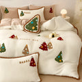 Bright yellow four-piece bedding set with a cartoon Christmas tree pattern, shown on a bed.