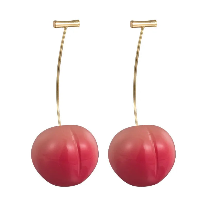 A pair of peach-shaped acrylic earrings on copper posts, shown in small and large size options.