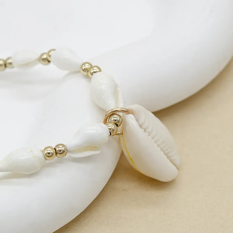White Mother of Pearl conch shell pendant necklace on an electroplated chain.