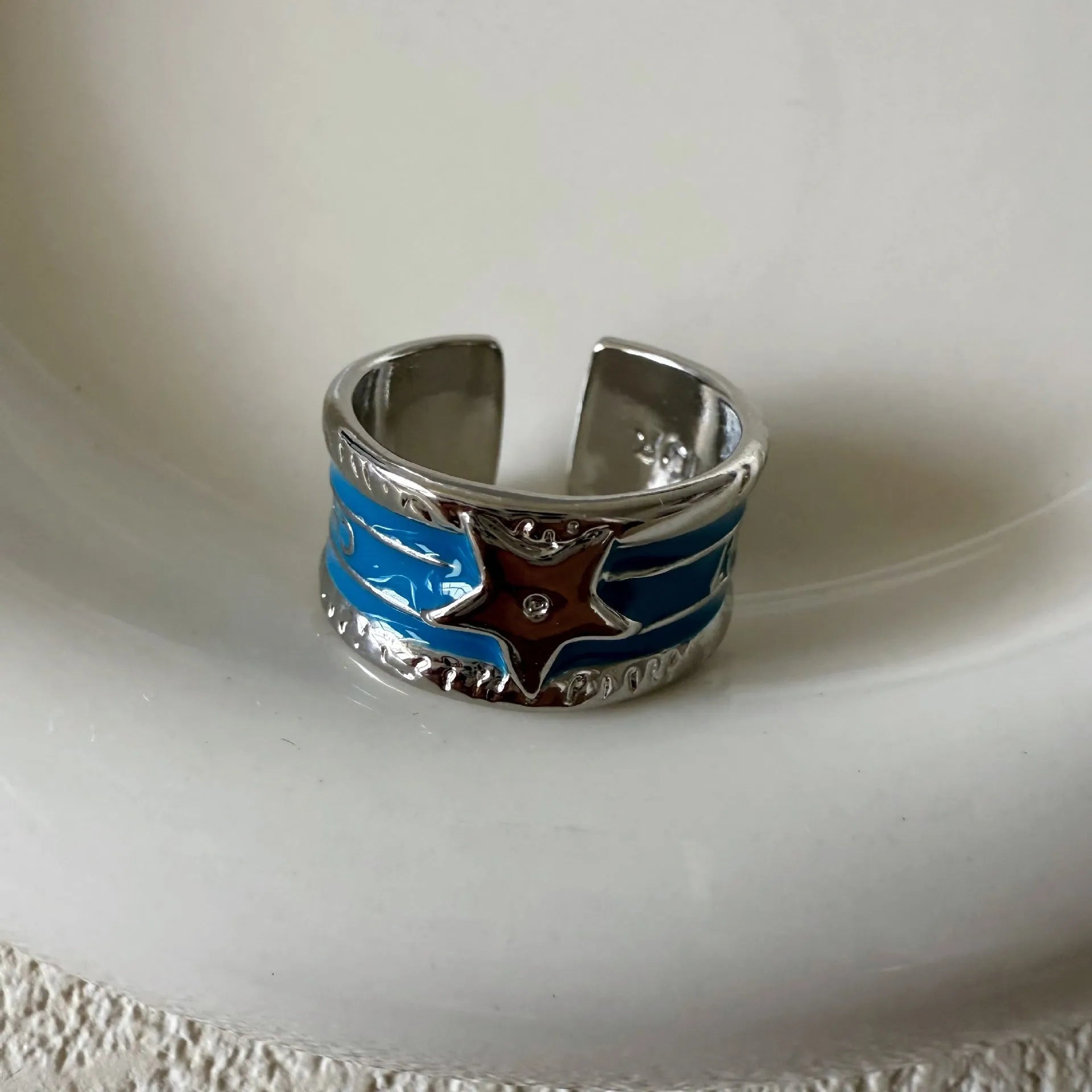 Adjustable copper ring with a geometric line pattern and retro distressed finish in four colour options.