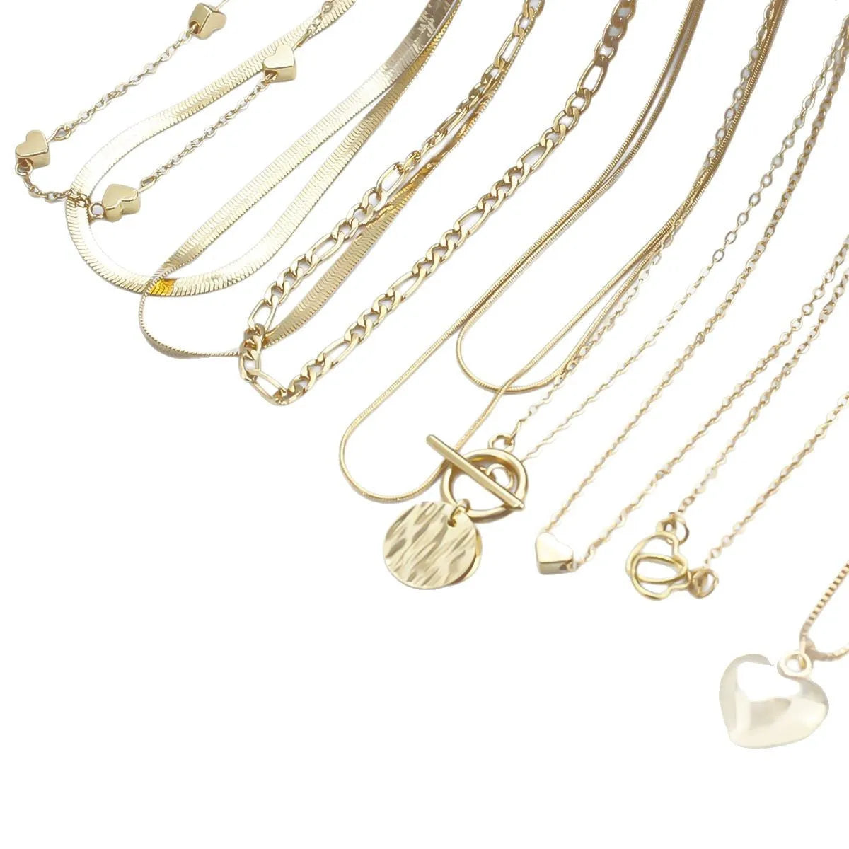 Ten gold electroplated necklaces with alloy pendants on adjustable snake bone chains