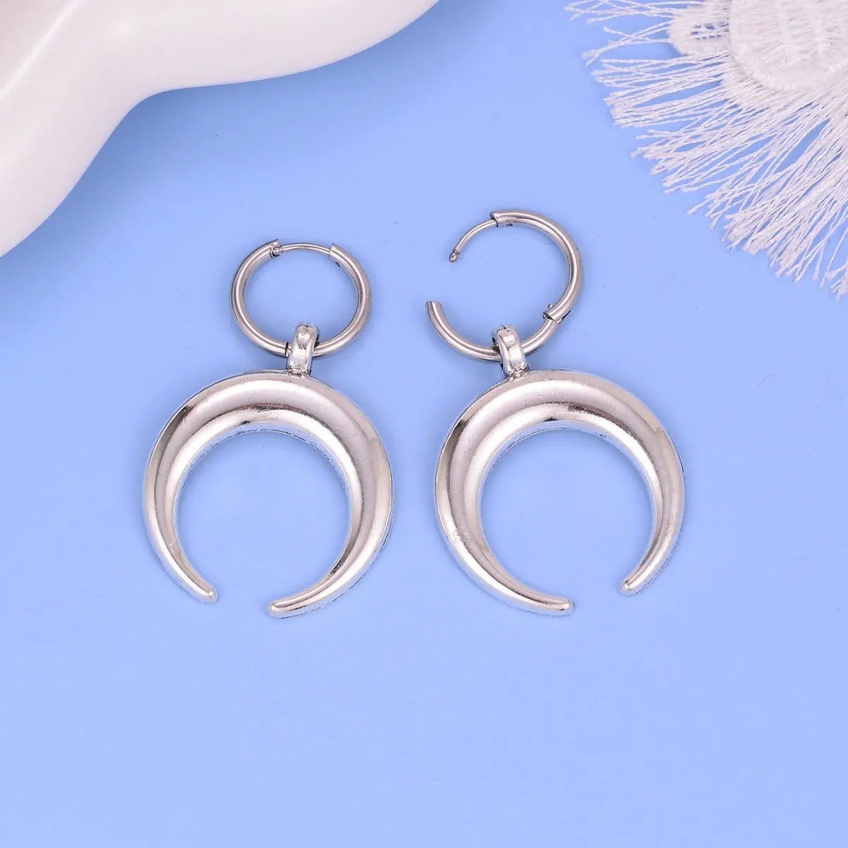 Silver geometric hoop earrings with gothic moon ornament, clip-on design